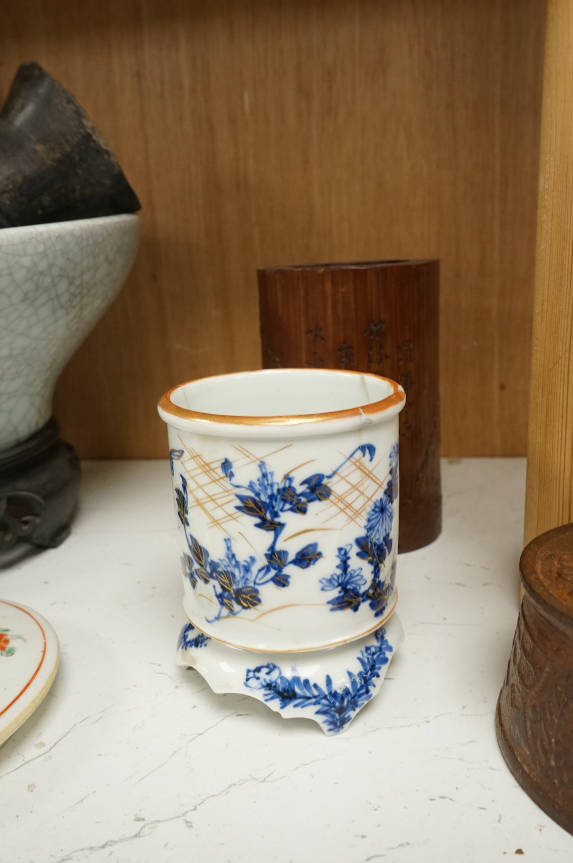 Oriental items to include a crackleglaze bowl on stand and a bamboo brush pot, together with two other vessels, largest 27cm in diameter